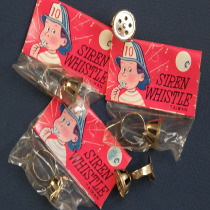SIREN WHISTLE RINGS

remember these?
adjustable metal whirling whistle rings...
from the 1950s... original packaging, made in taiwan
a drop of vegetable oil keeps the whistle whirling...